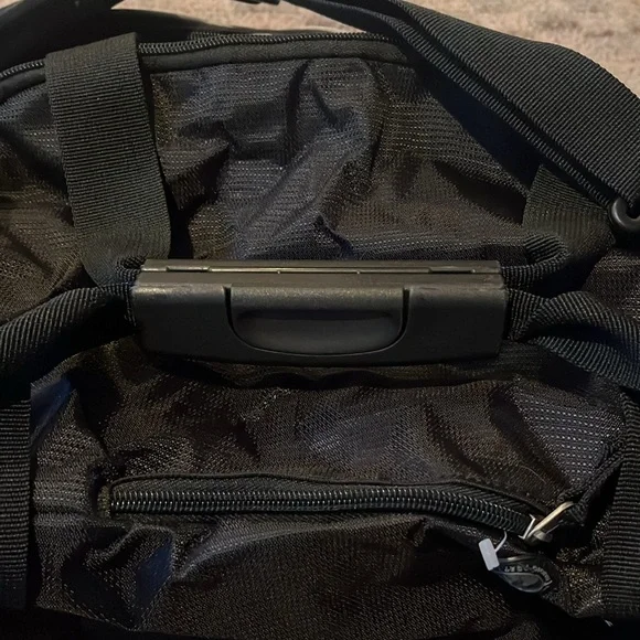 New OGIO sports illustrated black and gray duffle bag with shoulder strap.